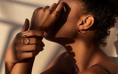 black woman with hand on face