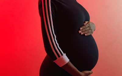 Woman Holding Pregnant Belly