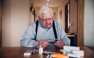 man taking medicines