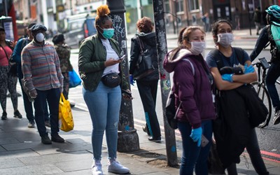 people wearing face masks in London street